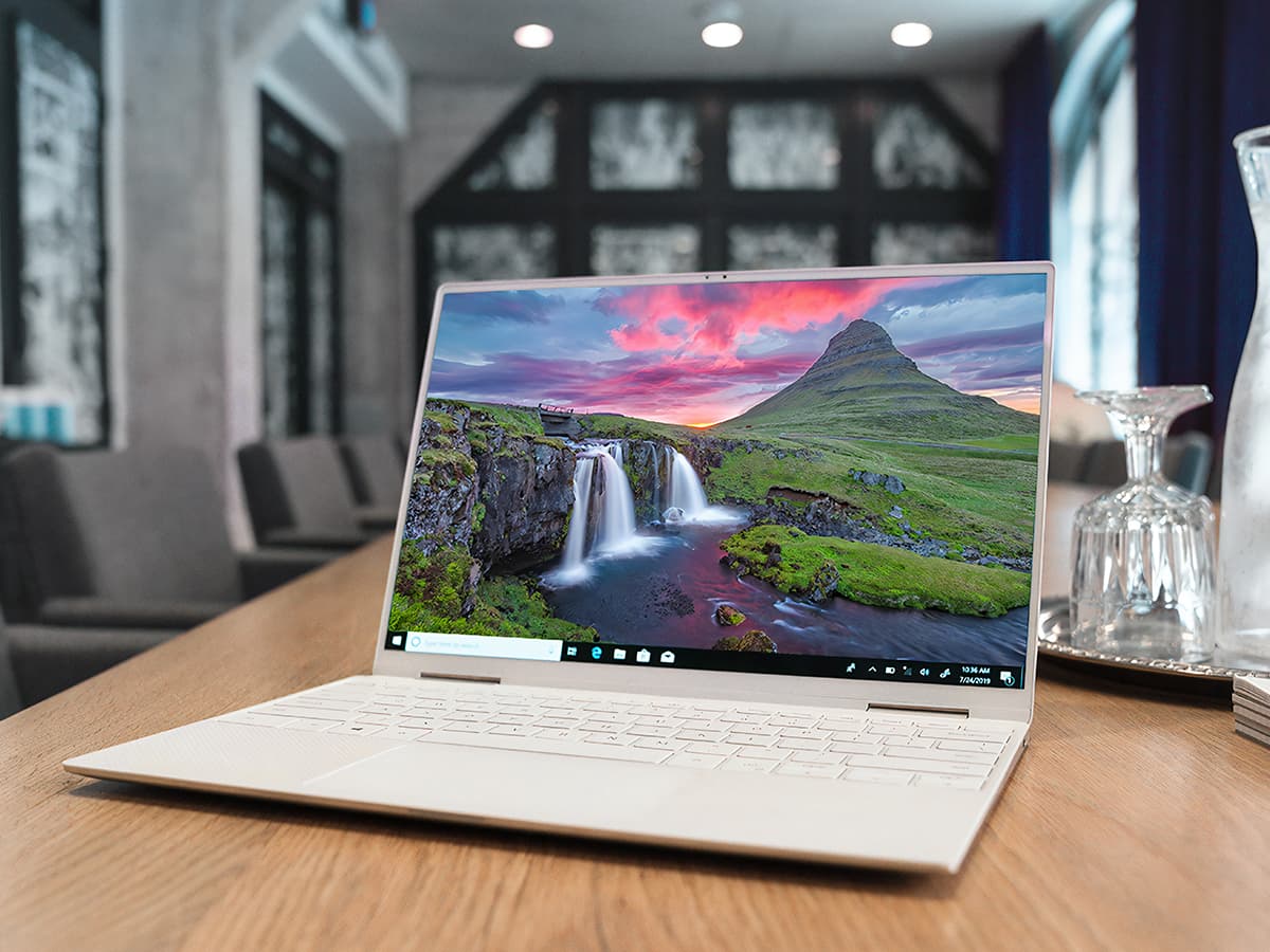 A white laptop on desk